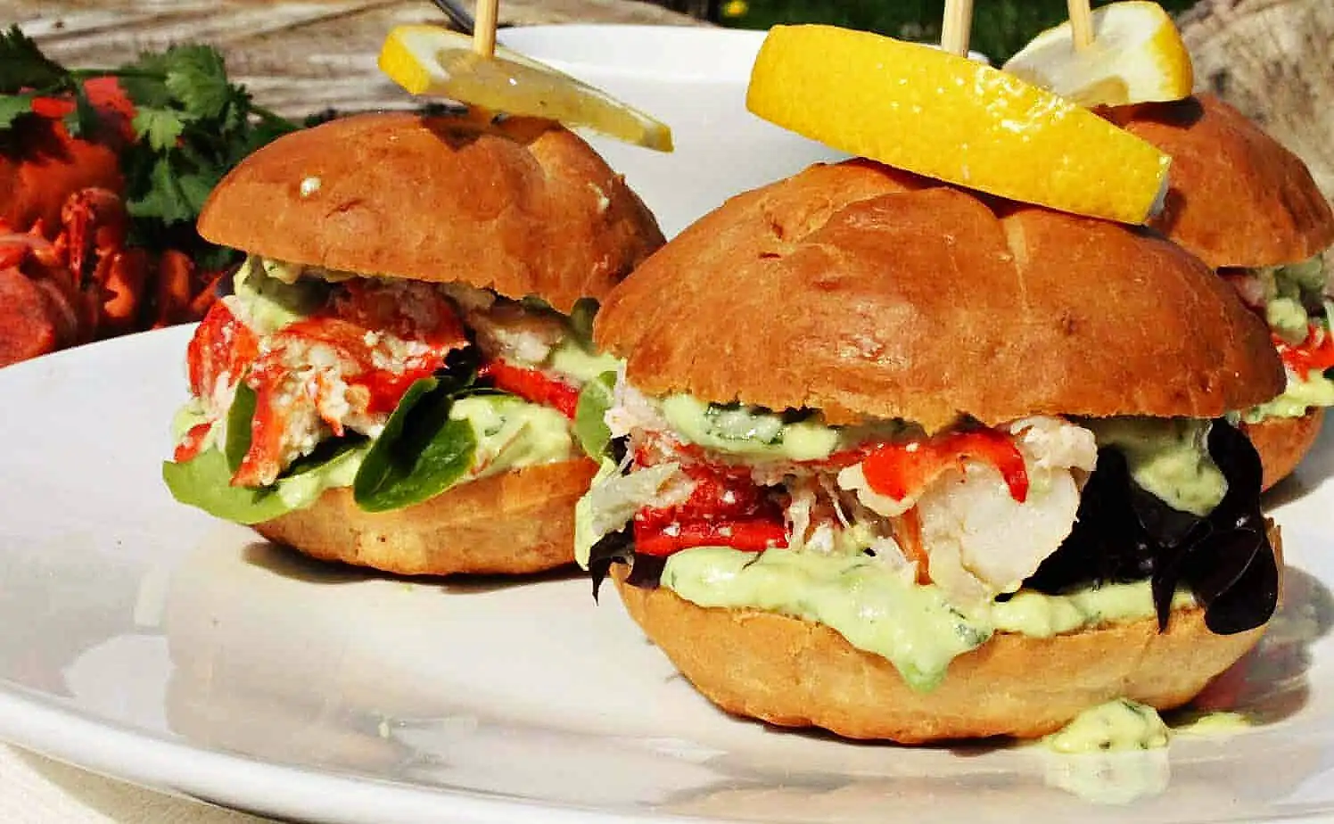 Close-up of lobster sliders showing all the bun fillings in detail