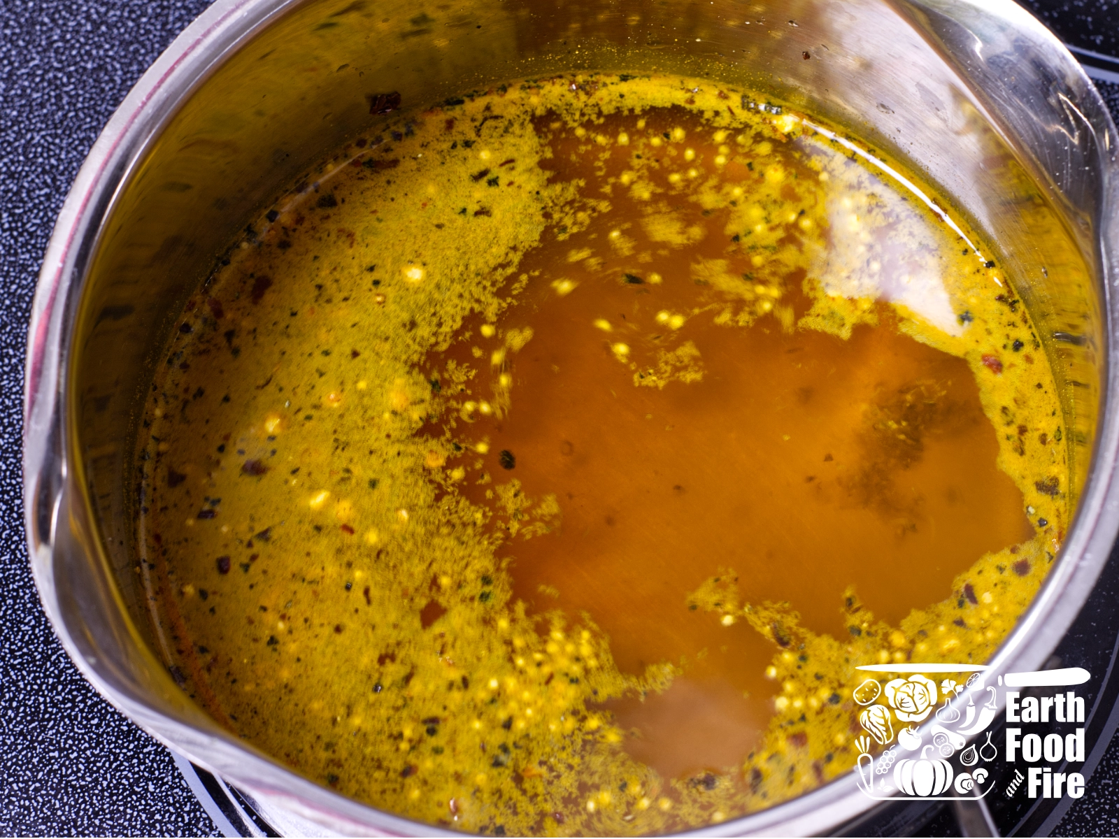 The pickling liquid with spices coming to a boil before it steeps off the heat.