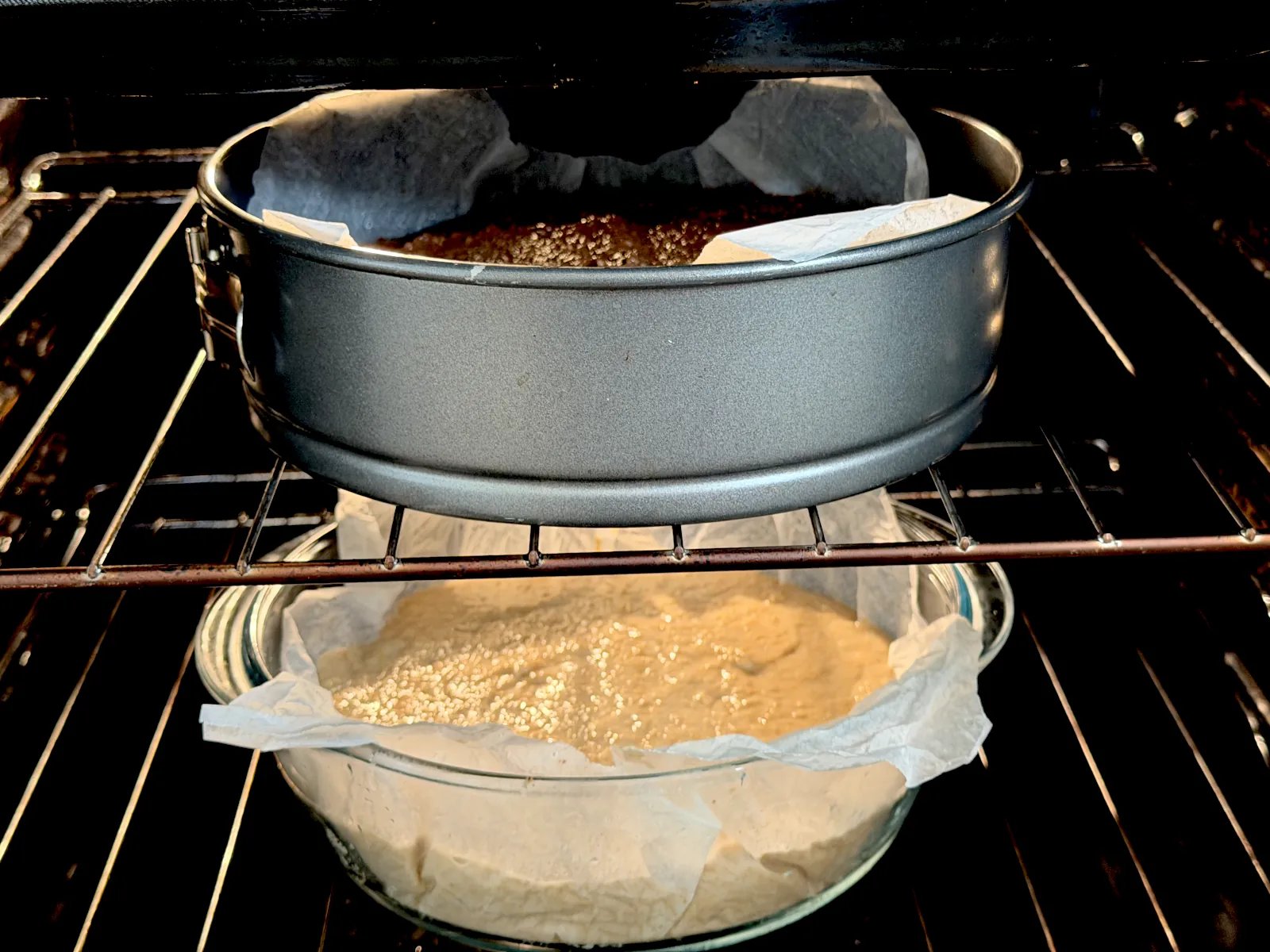 Vanilla and chocolate cakes are baking in the oven.