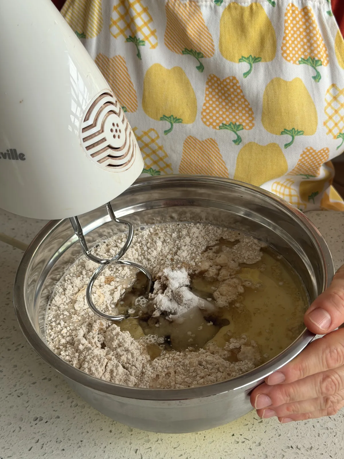 Mixing ingredients for vanilla cake with a hand mixer for recipes for cakes