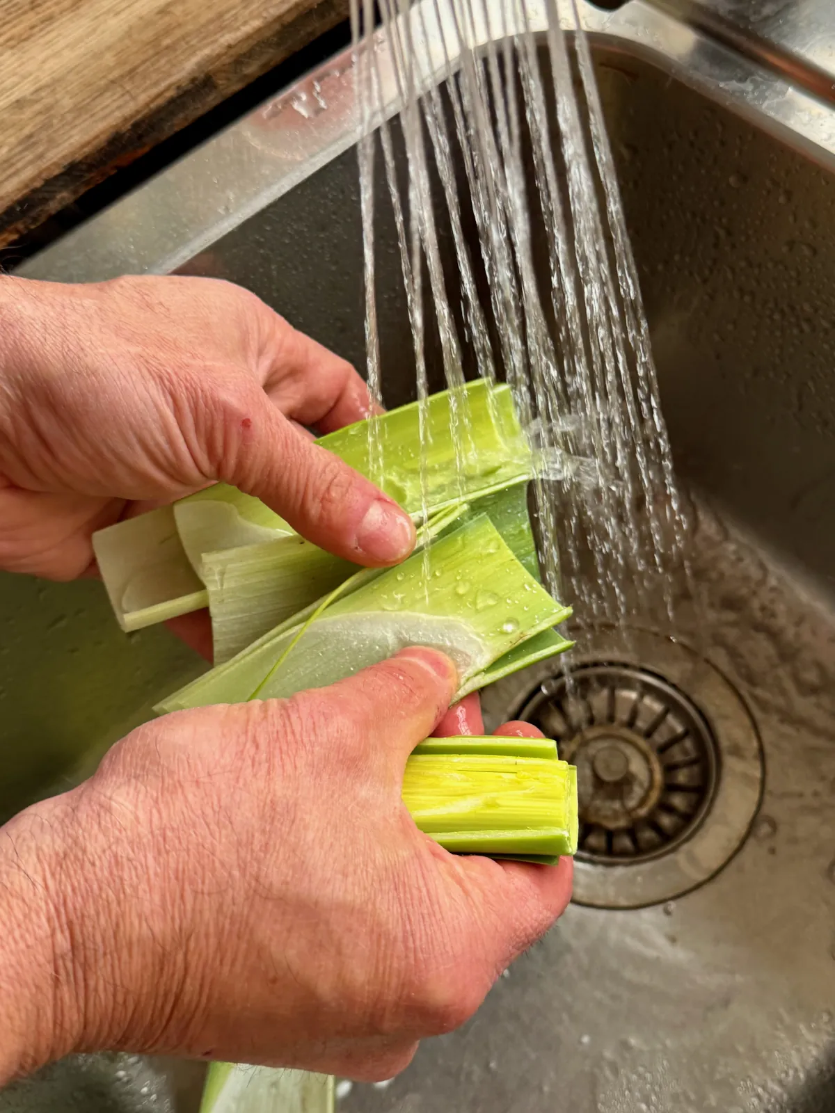 Washing leek under the running water